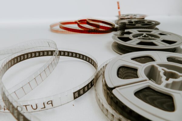 four reel films lying on white table