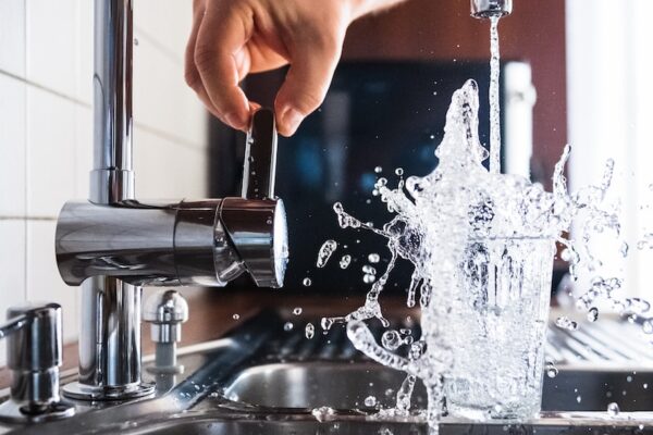 person opening faucet
